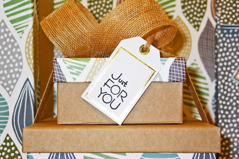 close up photo of gift boxes with greeting card